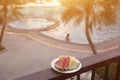 Delicious breakfast of fresh fruit on a plate - watermelon, melon, lime, papaya, pineapple, mint fnd fresh orange juice on old Royalty Free Stock Photo