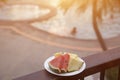 Delicious breakfast of fresh fruit on a plate - watermelon, melon, lime, papaya, pineapple, mint fnd fresh orange juice on old Royalty Free Stock Photo