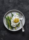 Delicious breakfast - lemon bread crumbs fried green beans and egg on a dark background, top view Royalty Free Stock Photo