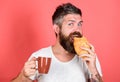 Delicious breakfast. Man start morning with coffee and croissant. Bearded hipster enjoy breakfast drink coffee. Morning Royalty Free Stock Photo