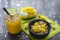 Breakfast of muesli with fresh mango pieces and cashew nuts with smoothie