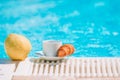 Delicious breakfast lemon, coffee, croissant by the pool Royalty Free Stock Photo