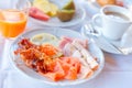Delicious breakfast served with coffee, orange juice, egg, ham, bacon rolls at the luxury hotel Royalty Free Stock Photo