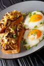 Delicious breakfast of shiitake toasts and fried eggs close-up. vertical Royalty Free Stock Photo