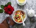 Delicious breakfast still life. Cottage cheese with natural yogurt, strawberries, kiwi, apricots, green tea and personal planner Royalty Free Stock Photo