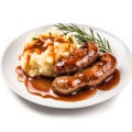 Delicious British Bangers and Mash with Gravy on a Plate .