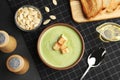 Delicious broccoli cream soup with croutons served on table, flat lay Royalty Free Stock Photo