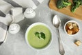 Delicious broccoli cream soup served on marble table, flat lay Royalty Free Stock Photo