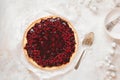Delicious brown butter custard tart with cranberry topping