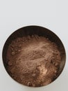 Delicious brown chocolate powder in a bowl. Royalty Free Stock Photo