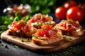Delicious bruschetta with prosciutto, tomatoes and herbs