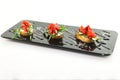 Delicious bruschette topped with mozzarella, olives, fresh tomato, basil, oregano and olive oil, typical italian snack,