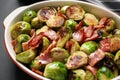 Delicious Brussels sprouts with bacon in baking pan