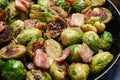 Delicious Brussels sprouts with bacon in pan, closeup