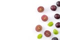 Delicious bunch of grapes fruit spilled over white table background Royalty Free Stock Photo