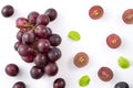 Delicious bunch of grapes fruit spilled over white table background Royalty Free Stock Photo