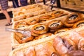 Buns with poppy seed curd filling in baskets in bakery Royalty Free Stock Photo