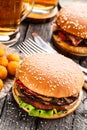 Delicious burger with fried potato balls and beer Royalty Free Stock Photo