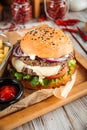 Delicious burger with lamb cutlet and vegetables Royalty Free Stock Photo