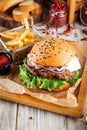 Delicious burger with lamb cutlet and vegetables Royalty Free Stock Photo
