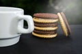 Delicious butter cream sandwich and cup of tea or coffee on the table. Close-up. Royalty Free Stock Photo