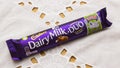 A delicious Cadbury milk chocolate bar in bright colourful packaging ready for eating