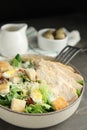 Delicious Caesar salad in bowl on grey table, closeup Royalty Free Stock Photo