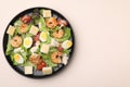 Delicious Caesar salad with shrimps on beige table, top view. Space for text Royalty Free Stock Photo