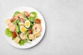 Delicious Caesar salad with shrimps on light table, top view. Space for text Royalty Free Stock Photo