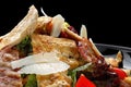 Caesar salad with crispy bacon, grilled chicken, and Parmesan cheese. close-up Royalty Free Stock Photo