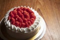 Delicious cake adorned with fresh strawberries, a tempting dessert capturing the essence of sweetness and fruitiness