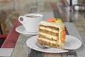 Delicious cake and cup of hot coffee on wooden table Royalty Free Stock Photo