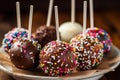 delicious cake pops decorated with frosting chocolate and sprinkles Royalty Free Stock Photo