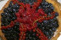 Delicious cake with wild berries  top view. Berry pie close up. Chic dessert Royalty Free Stock Photo