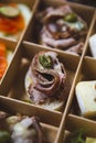 Delicious canape snack with beef meat delivered in cardboard box for catering service on wine party