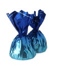 Delicious candies in blue wrappers on white background Royalty Free Stock Photo