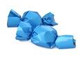 Delicious candies in light blue wrappers isolated on white Royalty Free Stock Photo