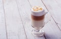 Delicious cappuccino on plank wooden table Royalty Free Stock Photo