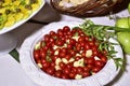 Delicious caprese salad with ripe cherry tomatoes and mini mozzarella cheese balls with fresh basil leaves. Italian healthy food Royalty Free Stock Photo