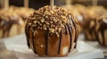 Delicious Caramel Apple With Chocolate and Nuts Displayed on a White Paper Royalty Free Stock Photo