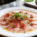 A delicious carpaccio of fresh swordfish, seasoned with extra virgin olive oil, chives and a few drops of lemon juice