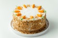 Delicious carrot cake decorated with mastic sweet carrots