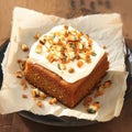 Delicious carrot or spice cake topped with creamy cheese frosting.