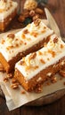 Delicious carrot or spice cake topped with creamy cheese frosting.