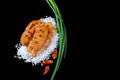 Delicious caviar, roe closeup, pike caviar flat lay on sea white salt, green onions, red hot pepper on a black background, top vie