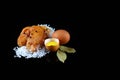 Delicious caviar, roe closeup, pike caviar flat lay on sea white salt, raw eggs, laurel leaves, place for text on a black backgrou