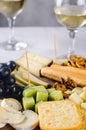 Delicious cheese mix with grapes, jam, snacks, crackers, walnuts Royalty Free Stock Photo