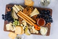 Delicious cheese mix with grapes, jam, snacks, crackers, walnuts Royalty Free Stock Photo