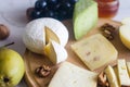 Delicious cheese mix with grapes, jam, snacks, crackers, walnuts Royalty Free Stock Photo
