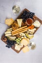 Delicious cheese mix with grapes, jam, snacks, crackers, walnuts Royalty Free Stock Photo